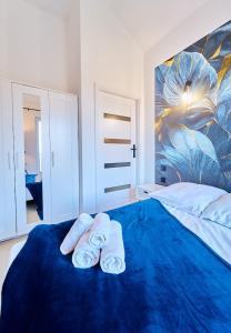 Posteľ alebo postele v izbe v ubytovaní LAGUNA Apartament Polanica Residence 59 z klimatyzacją