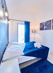 Posteľ alebo postele v izbe v ubytovaní LAGUNA Apartament Polanica Residence 59 z klimatyzacją