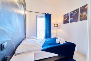 Posteľ alebo postele v izbe v ubytovaní LAGUNA Apartament Polanica Residence 59 z klimatyzacją