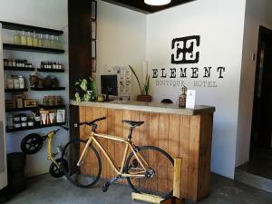a bike parked next to a counter in a store at ELEMENT BOUTIQUE HOTEL in Manila