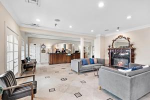 a living room with two couches and a fireplace at Villa Lanai at the Sunset Cove Villas in Laguna Beach