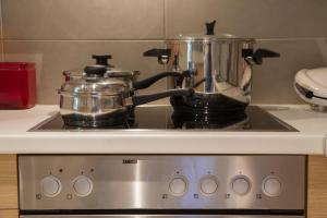 A kitchen or kitchenette at Lovely New Βuild Flat Near Metro - Free Parking