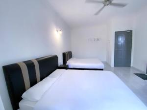 Venice Guest Hostel - Bilik Sahaja客房内的一张或多张床位
