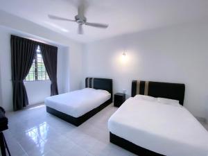 Voodi või voodid majutusasutuse Venice Guest Hostel - Bilik Sahaja toas