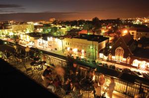 a view of a city at night with lights at Market Pavilion Hotel in Charleston