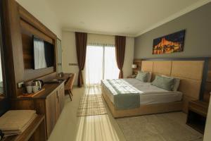 Кровать или кровати в номере Mc Palace Hotel Spa & Convention