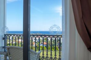 a view of the ocean from a balcony at Mc Palace Hotel Spa & Convention in Kyrenia