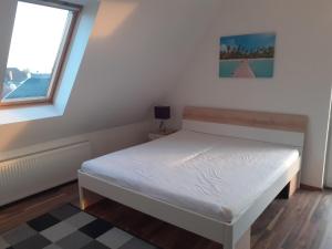 Postel nebo postele na pokoji v ubytování Aroma Apartman