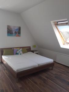 Postel nebo postele na pokoji v ubytování Aroma Apartman