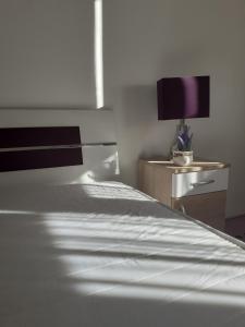 Postel nebo postele na pokoji v ubytování Aroma Apartman