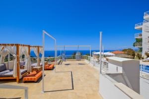 a balcony with a view of the ocean at Highclere Hotel and Spa in Faralya