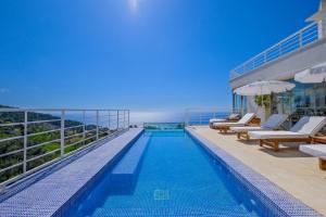 a swimming pool on the roof of a building at Highclere Hotel and Spa in Faralya