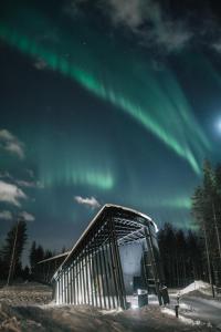 an igloo with the aurora in the sky at Nova Skyland Hotel in Rovaniemi