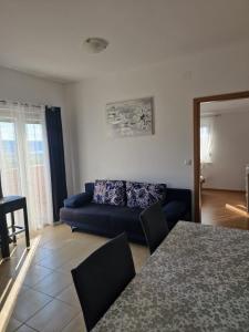 Postel nebo postele na pokoji v ubytování Apartmani Ivan