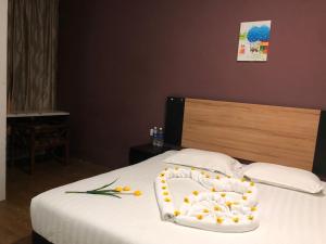 Letto o letti in una camera di Amigo Hotel