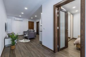 a living room with a large door leading to a bedroom at Sandstone A8 Marsascala - 15minute drive to Valletta in Marsaskala