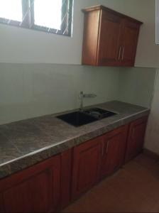 a kitchen with a sink and a counter top at Silver Rose Holiday Home in Nuwara Eliya