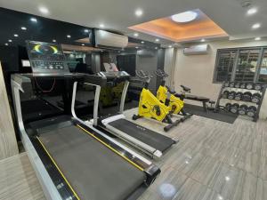 a fitness room with a bowling alley and a gym at 23 HOTEL & RESIDENCE in Yangon