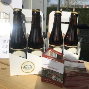 three bottles of beer sitting on top of a table at vakantiehuis-oyenkerke 2 in De Panne +38 photos