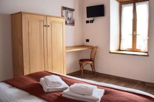 Postel nebo postele na pokoji v ubytování La Tana del Tasso Rooms&Breakfast