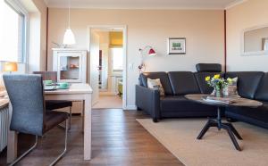 Posezení v ubytování Syltdomizil Westsuite + 16 fotografií