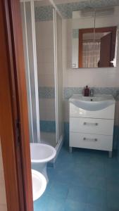a bathroom with a sink and a shower and a toilet at La Casa Dei Nonni in Naples +5 photos