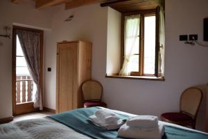Postel nebo postele na pokoji v ubytování La Tana del Tasso Rooms&Breakfast