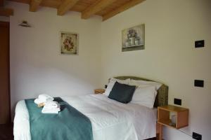 Postel nebo postele na pokoji v ubytování La Tana del Tasso Rooms&Breakfast