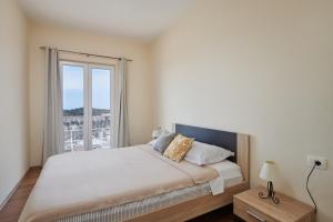 Posteľ alebo postele v izbe v ubytovaní Dubrovnik View Apartments