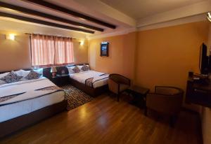 Postel nebo postele na pokoji v ubytování Hotel Garuda