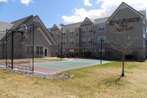 a tennis court in front of a building at Residence Inn Colorado Springs South in Colorado Springs