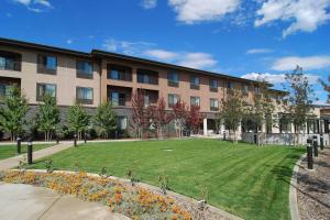 a building with a large lawn in front of it at Fairfield Inn & Suites Tehachapi in Tehachapi