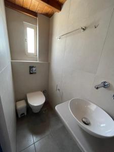 Kúpeľňa v ubytovaní Belou apartment