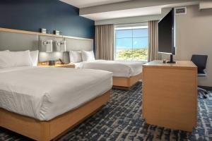 เตียงในห้องที่ Residence Inn by Marriott Jekyll Island