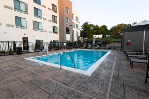 a swimming pool in front of a building at Courtyard by Marriott Cartersville in Cartersville