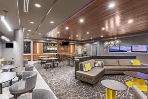 a lobby with a couch and chairs and tables at SpringHill Suites by Marriott Austin West/Lakeway in Lakeway