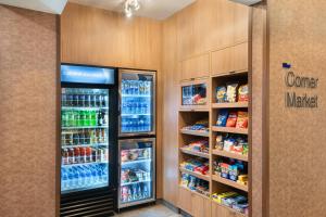 a store aisle with two large refrigerators and drinks at Fairfield Inn & Suites by Marriott Lexington East/I-75 in Lexington