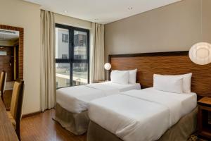 Katil atau katil-katil dalam bilik di Protea Hotel by Marriott Ikeja Select