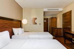 Katil atau katil-katil dalam bilik di Protea Hotel by Marriott Ikeja Select