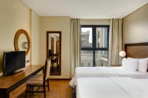 Katil atau katil-katil dalam bilik di Protea Hotel by Marriott Ikeja Select