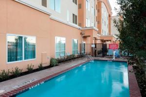 a swimming pool in front of a building at Residence Inn by Marriott Dallas Plano/Richardson in Plano