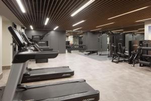 a gym with cardio equipment and treadmills at Marriott Executive Apartments Istanbul Fulya in Istanbul