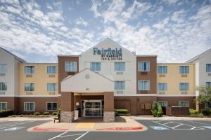 a rendering of the front of a hotel with a parking lot at Fairfield Inn & Suites Austin University Area in Austin