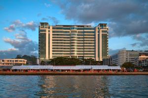a large group of people on a boat in the water at Le Meridien Kota Kinabalu in Kota Kinabalu