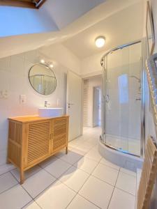 a bathroom with a sink and a shower at Kieler-FeWo-No-1 in Kiel