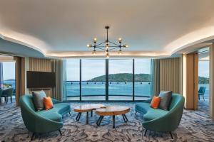 a hotel room with a view of the water at Le Meridien Kota Kinabalu in Kota Kinabalu