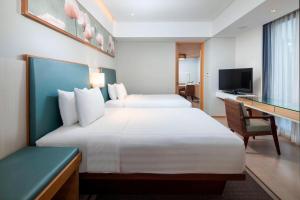 Courtyard by Marriott Bali Seminyak Resort客房内的一张或多张床位