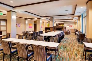 a large dining room with tables and chairs at Residence Inn by Marriott Bangor in Bangor