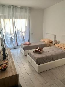 Tempat tidur dalam kamar di Einaudi Apartment