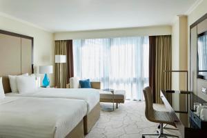 Postel nebo postele na pokoji v ubytování London Marriott Hotel Canary Wharf